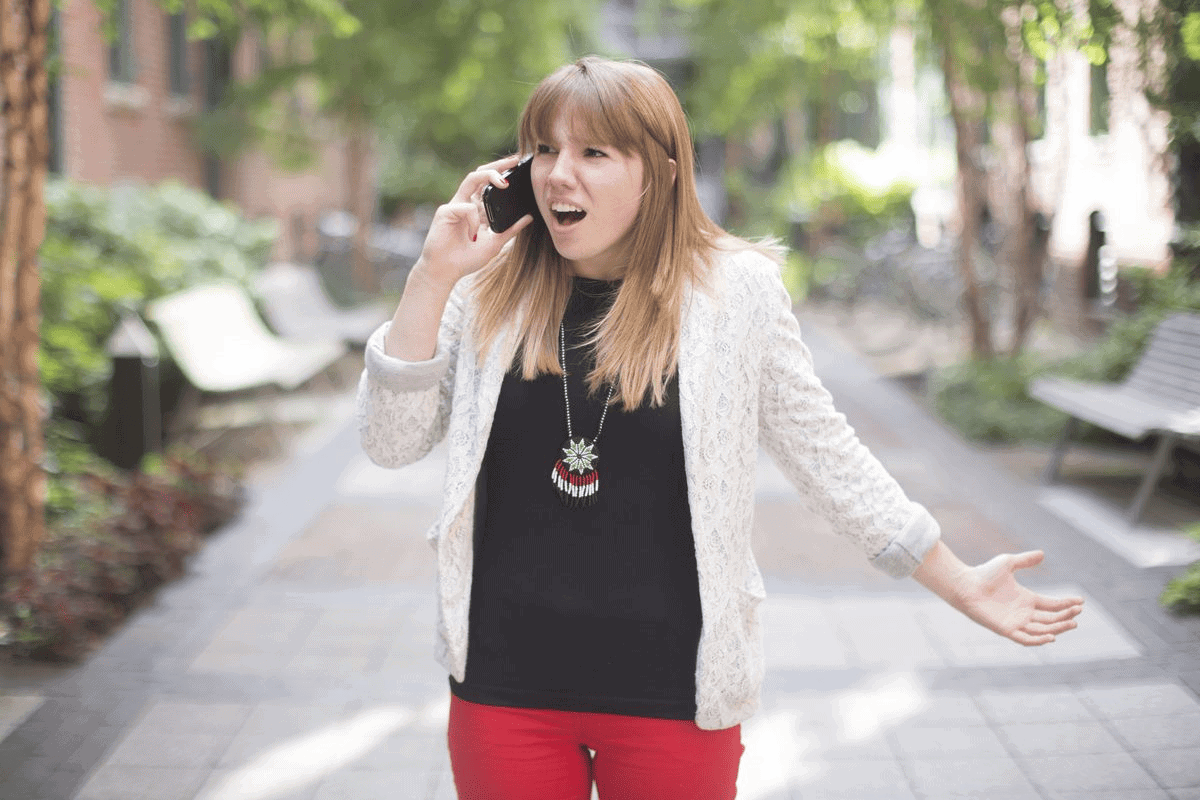 Frustrated business casual female on phone