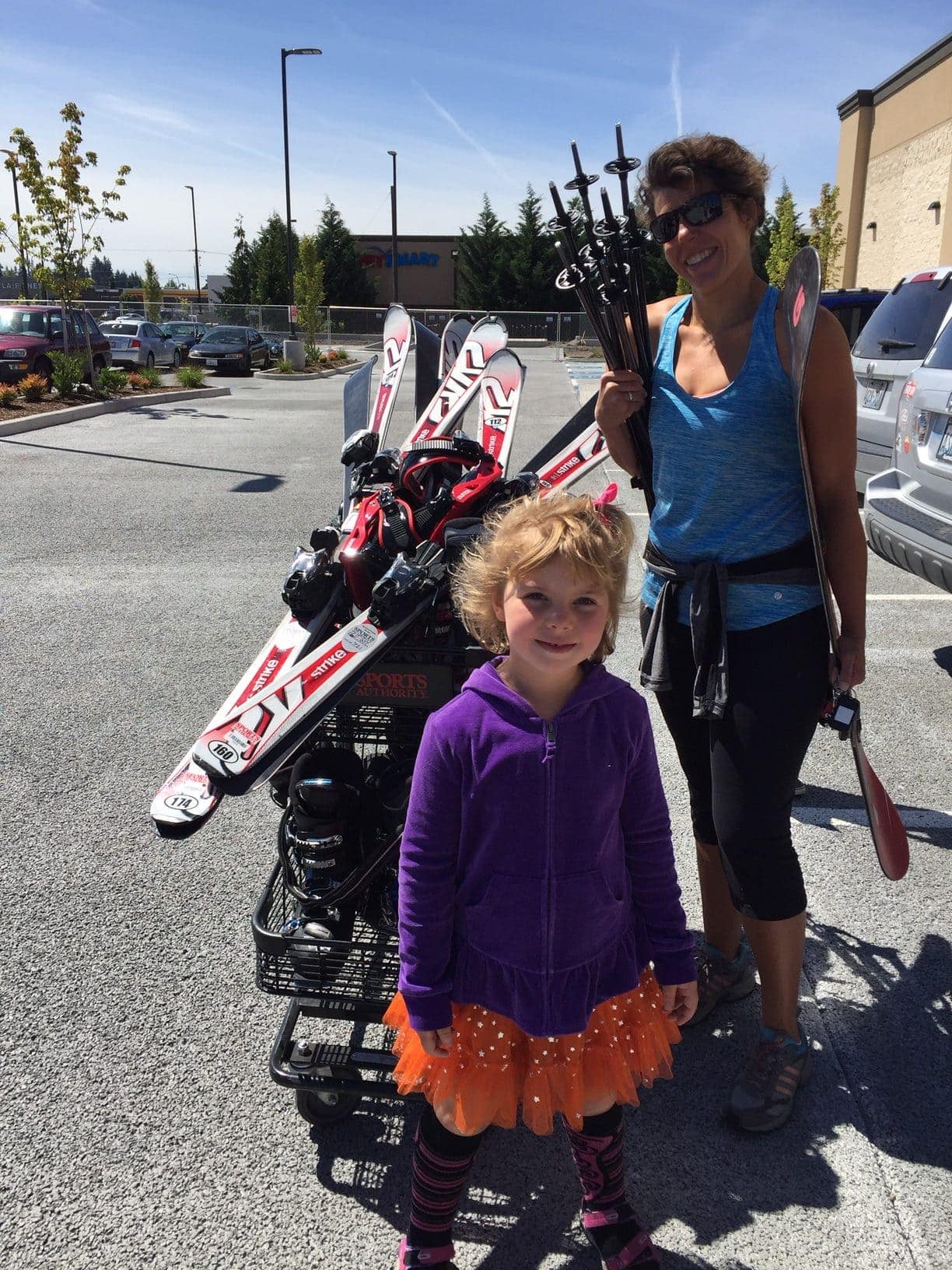 Picture of mother and daughter buying skis