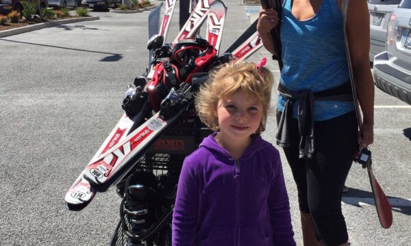 Picture of mother and daughter buying skis